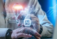 AI Skills for Office Jobs – What Workers Should Learn First in 2026 Worker touches a glowing AI chip interface while a lightbulb appears above it