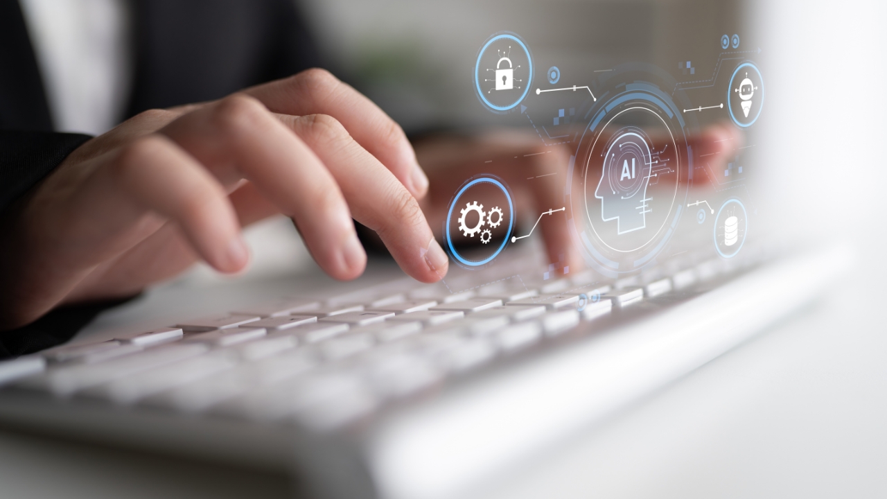 Hands type on a keyboard with AI security icons shown above the keys