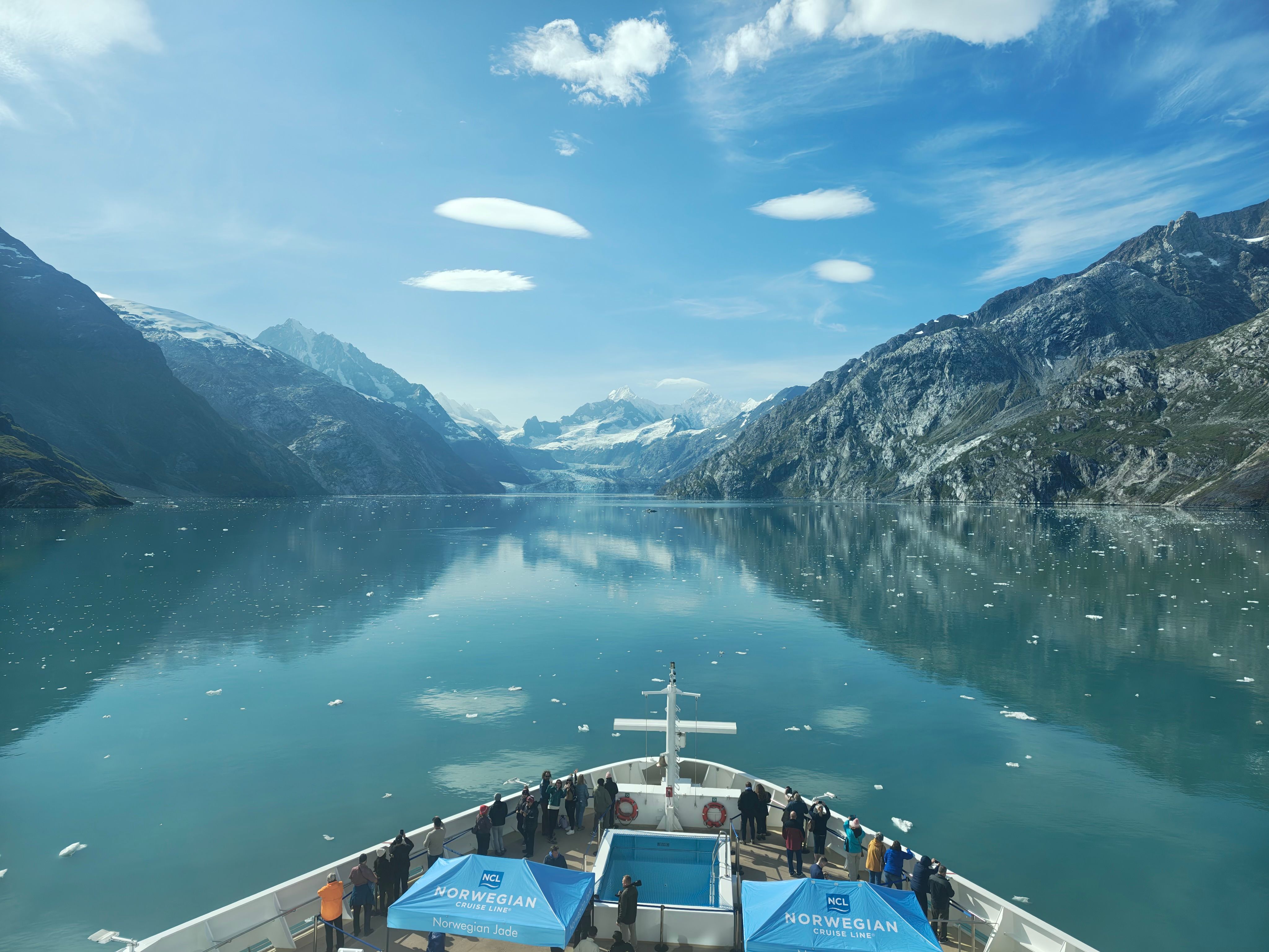 Cruise ship sailing through Glacier Bay surrounded by Alaska's icy wilderness.