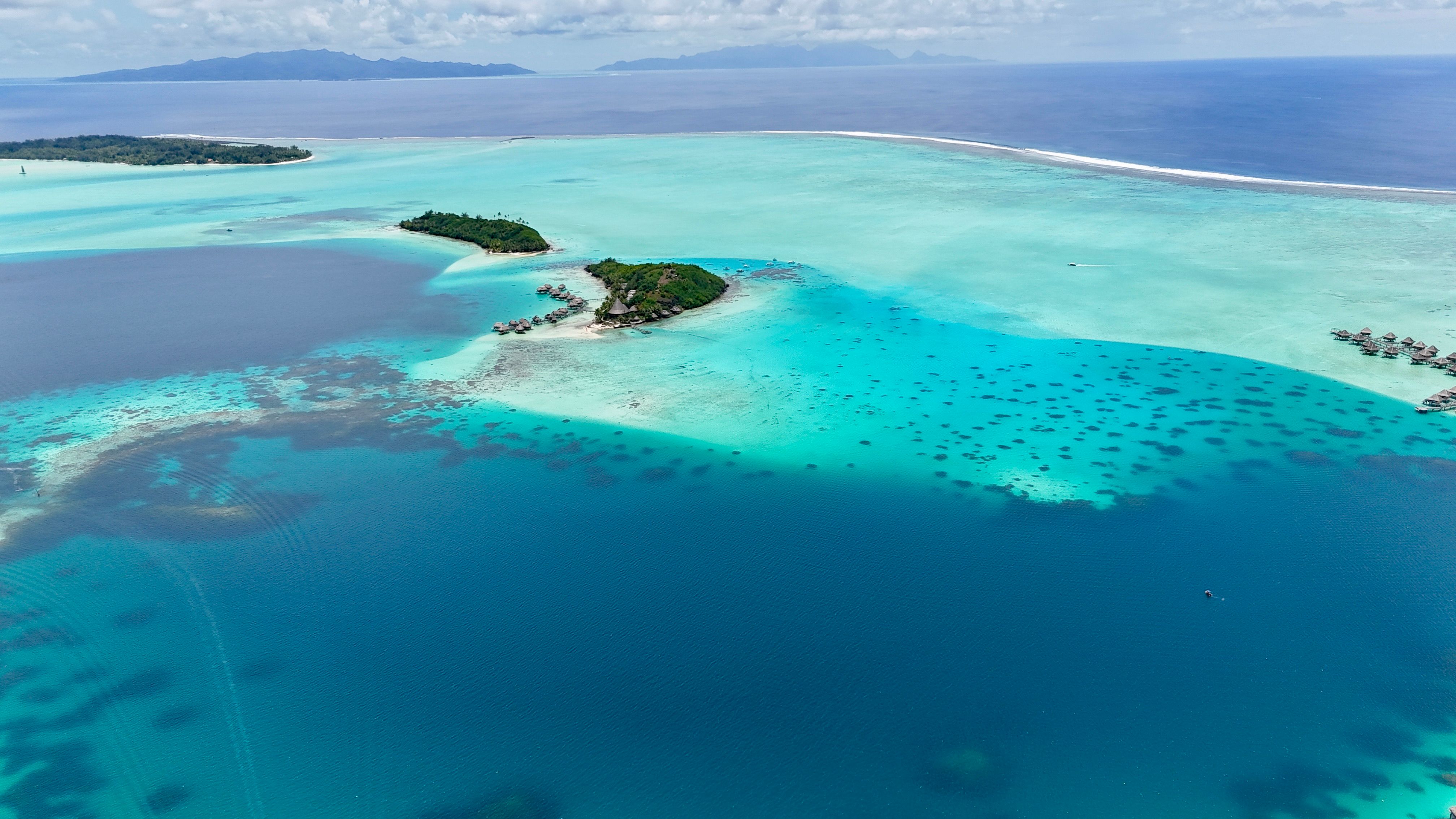 Aerial view of Bora Bora's turquoise lagoon and lush tropical islands